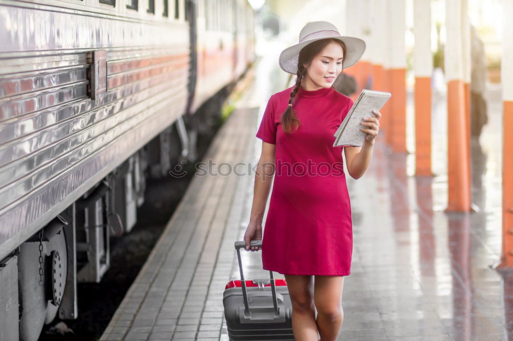 Similar – Image, Stock Photo Young woman with mobile phone at train station