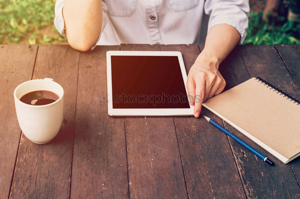 Similar – Image, Stock Photo Close-up shot ofwoman working with tablet computer on sunset and sea background