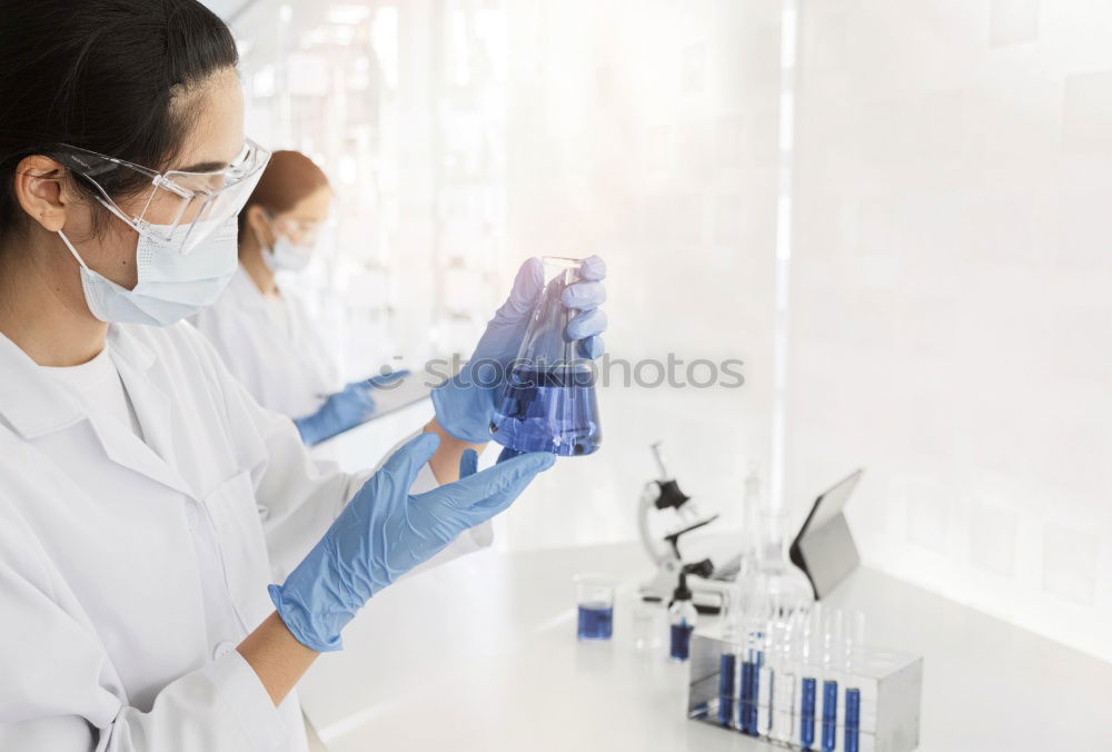 Image, Stock Photo Worker putting liquid to test tube