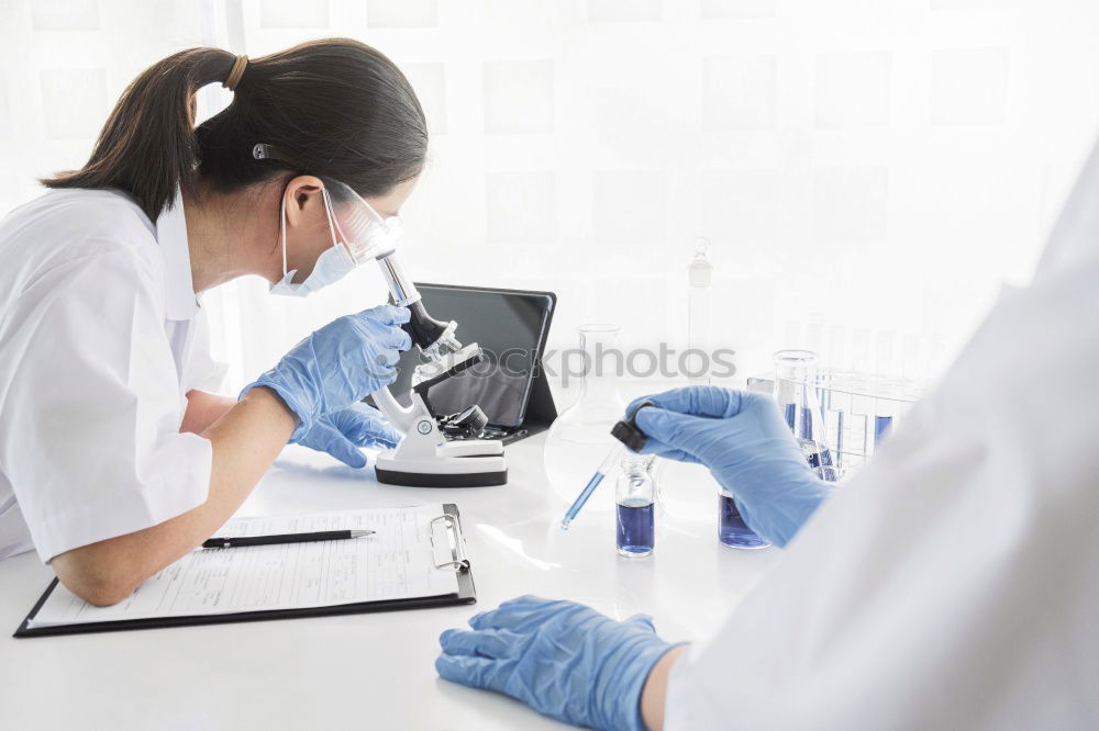 Similar – Image, Stock Photo Worker putting liquid to test tube