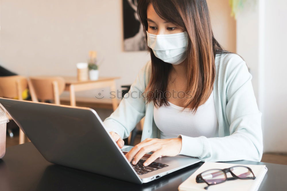 Similar – Young Businessman Wearing Mask Working On Laptop At Hot Desk In Office During Health Pandemic