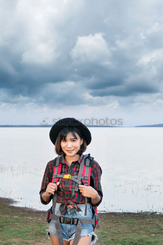 Similar – Low view of a young woman in nature