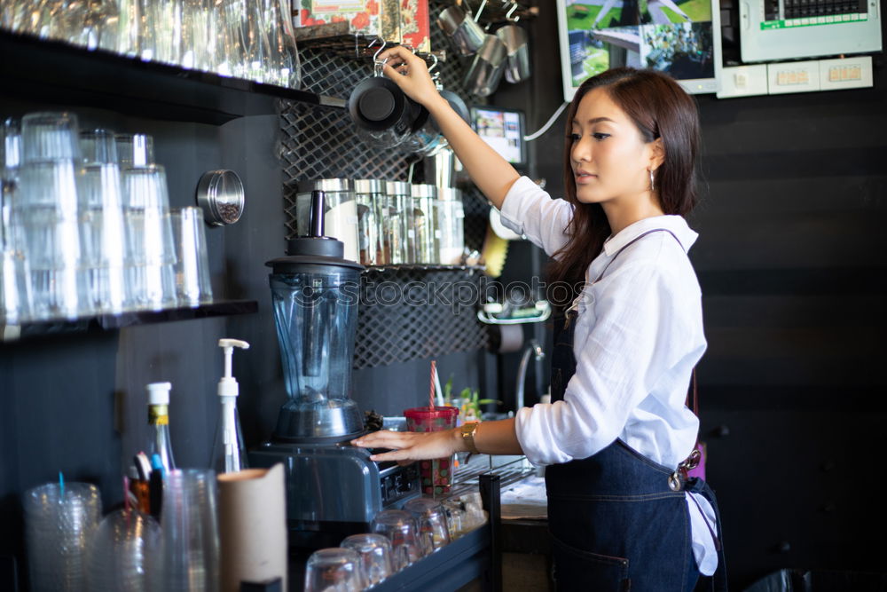 Similar – Image, Stock Photo smiling young Barista making coffee in cafe