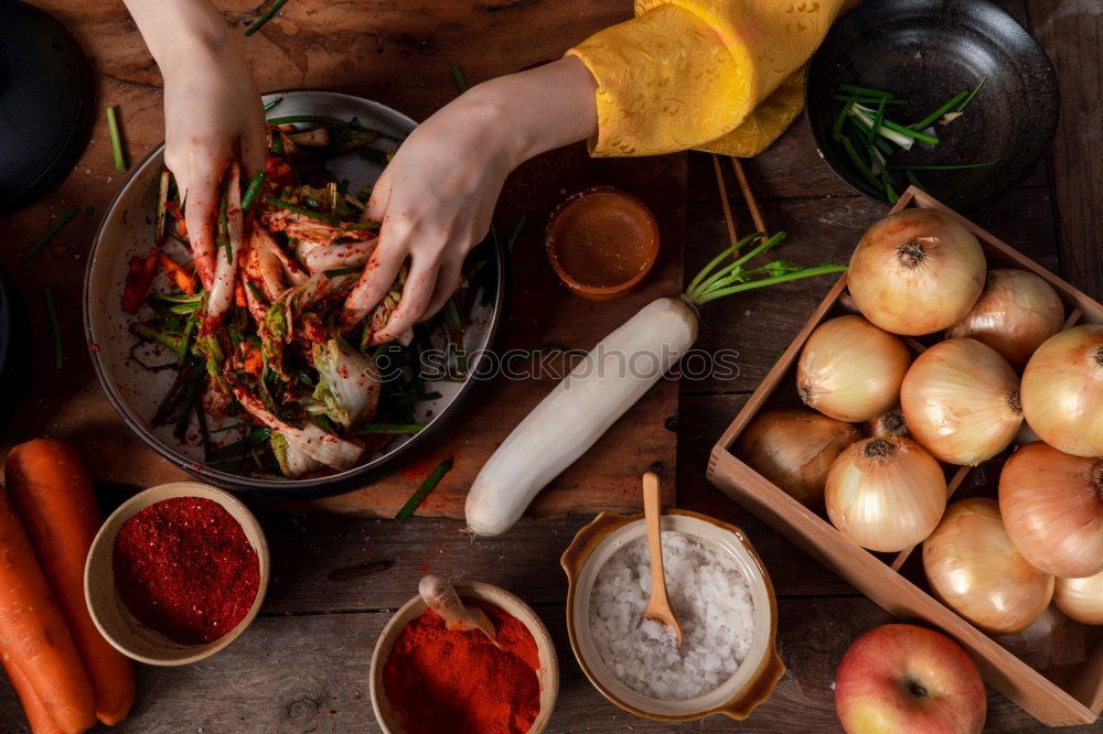 Similar – Image, Stock Photo Two women’s hands clean large carrots for slicing