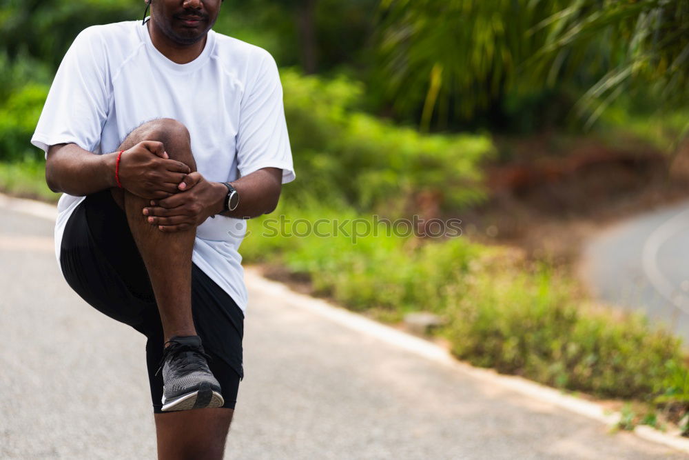 Similar – Image, Stock Photo Black man doing stretching after running outdoors