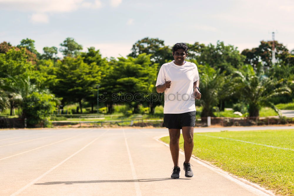 Disabled man athlete training with leg prosthesis.