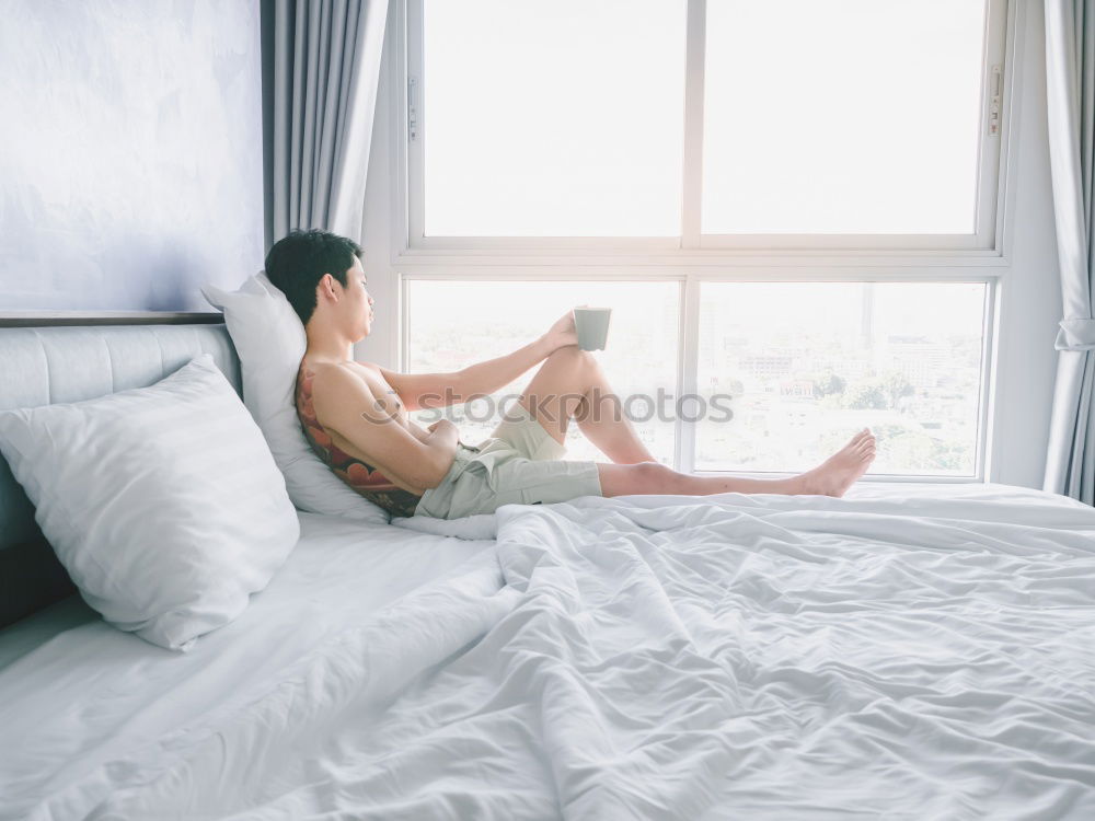 Similar – Image, Stock Photo A bed with two feet coming out of the sheets