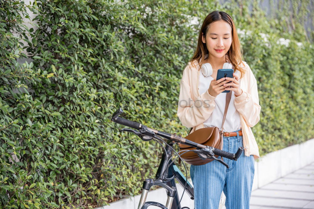 Similar – Image, Stock Photo Women with bikes browsing smartphone