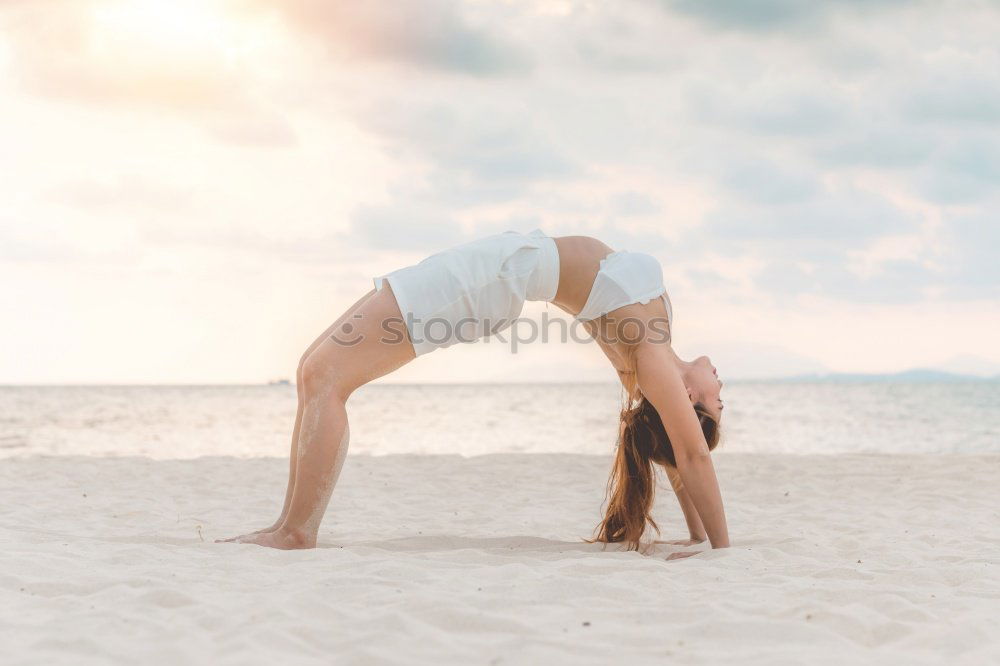 Similar – Image, Stock Photo Caucasian blonde woman practicing yoga in the beach