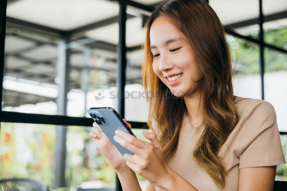 Image, Stock Photo Asian young woman texting message with phone