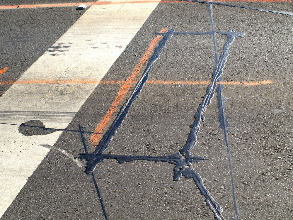 Similar – Crime scene road III | outline of a person lying on the road marked with white spray paint on black asphalt