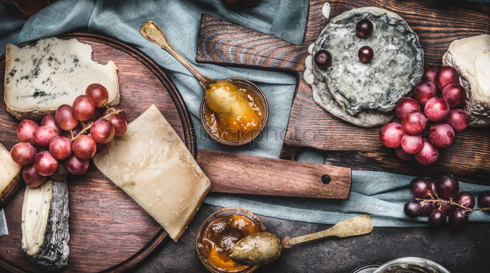 Similar – Image, Stock Photo Fine cheeses with wine, grapes and honey sauce