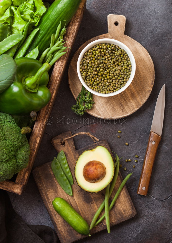 Similar – Green kale pesto in glass on dark rustic kitchen table background with ingredients, top view. Kale preparation. Healthy detox vegetables . Clean eating and dieting concept.