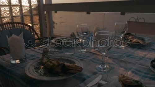 Similar – Image, Stock Photo View from above of a garden table set in summer, at which a young man is sitting