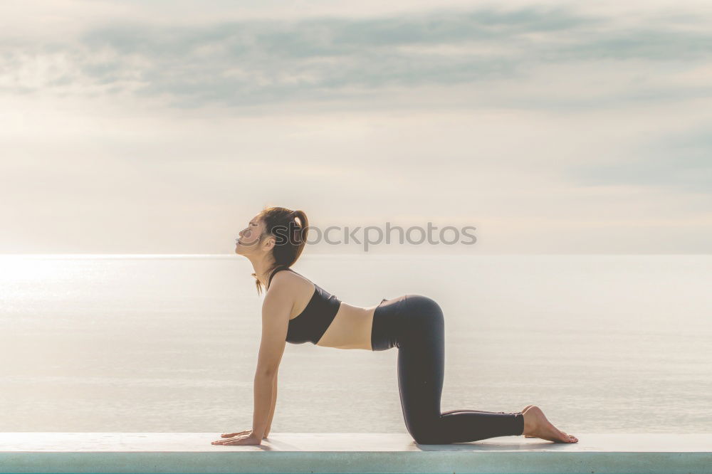 Similar – Image, Stock Photo Caucasian blonde woman practicing yoga in the beach