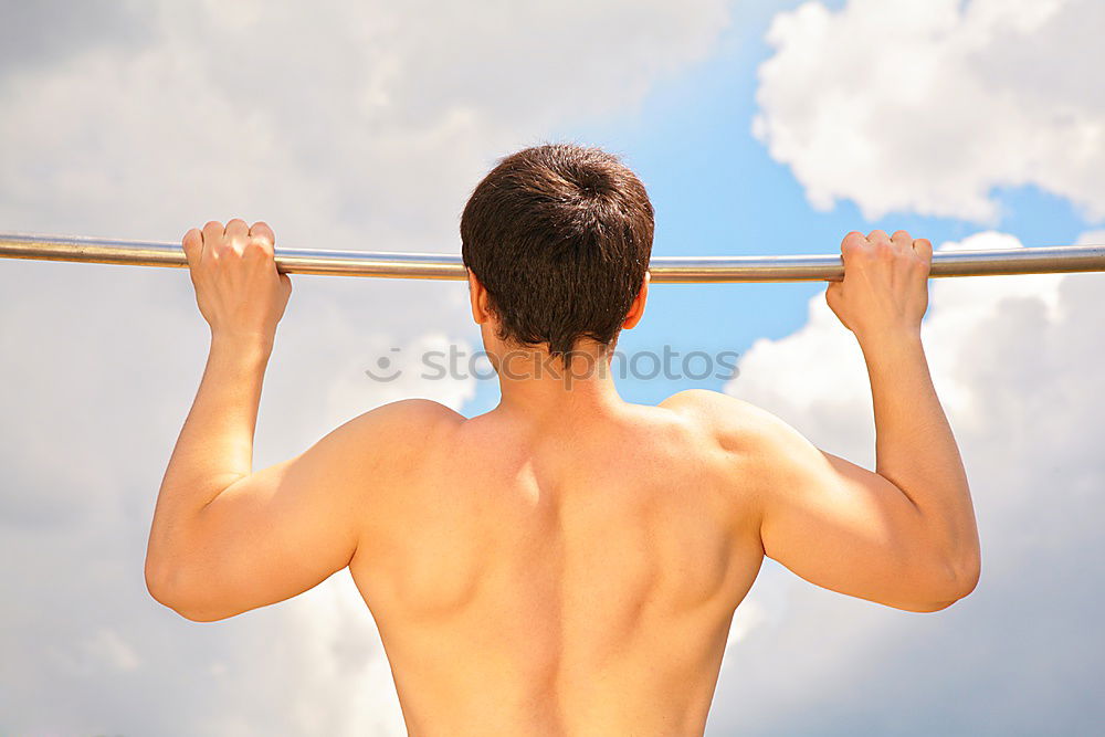 Similar – Young man stretching a resistance rubber band before calisthenics training