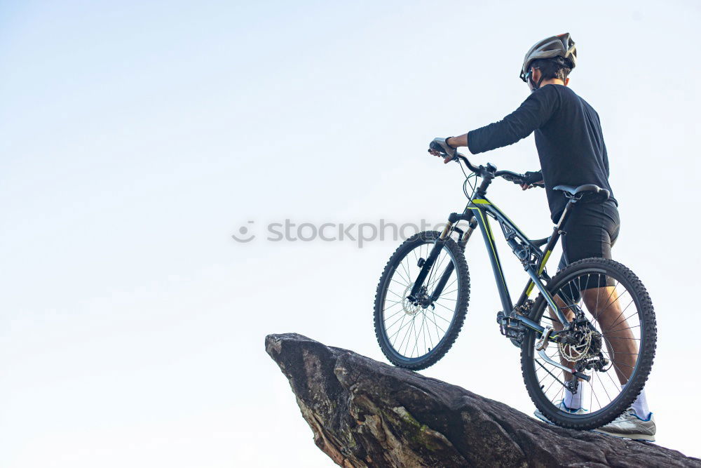 Similar – Cyclist extreme jumping