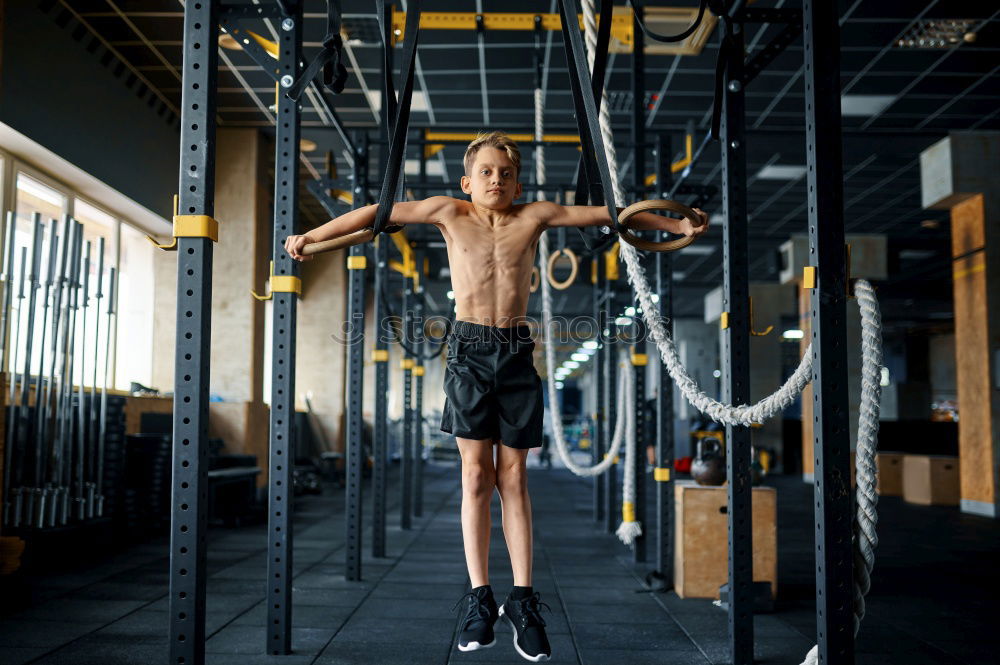 Similar – Image, Stock Photo Women training chins in gym in back image