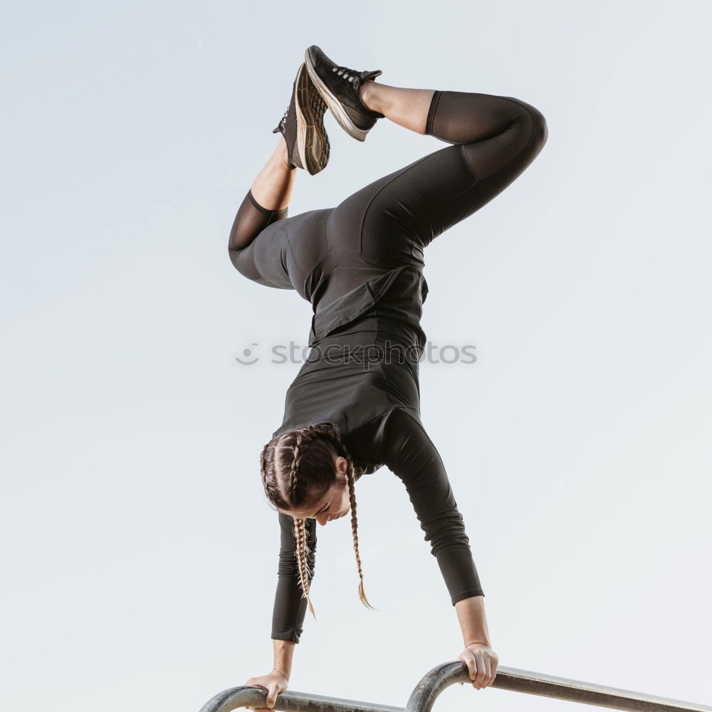 Similar – Image, Stock Photo Young woman doing pull ups in gym