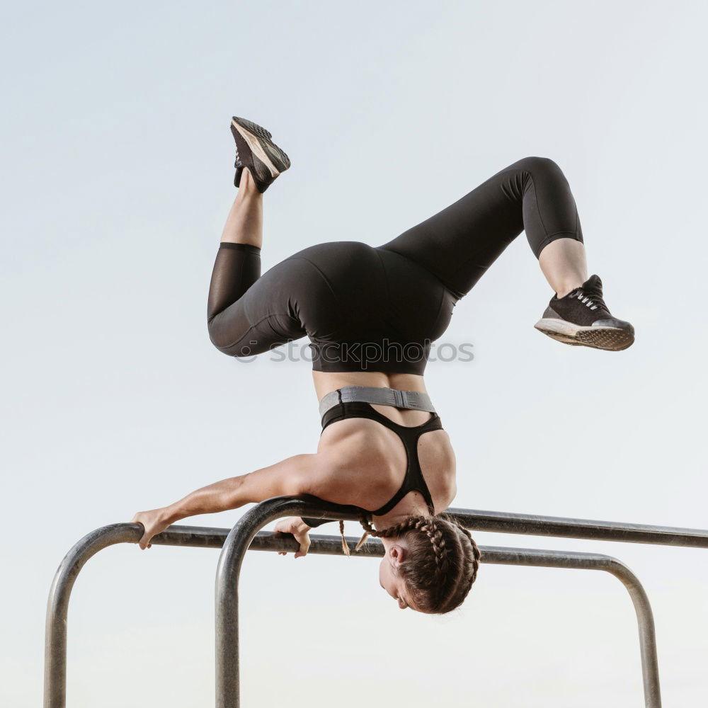 Similar – Schlanke Frau macht Handstand beim Training