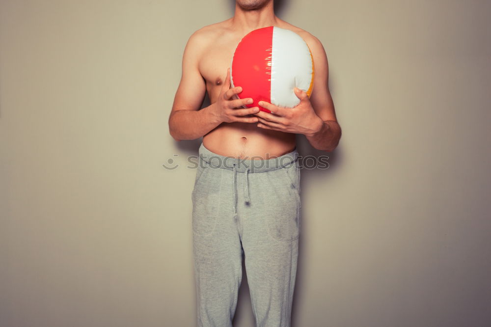 Similar – A househusband in pink slippers and cleaning utensils