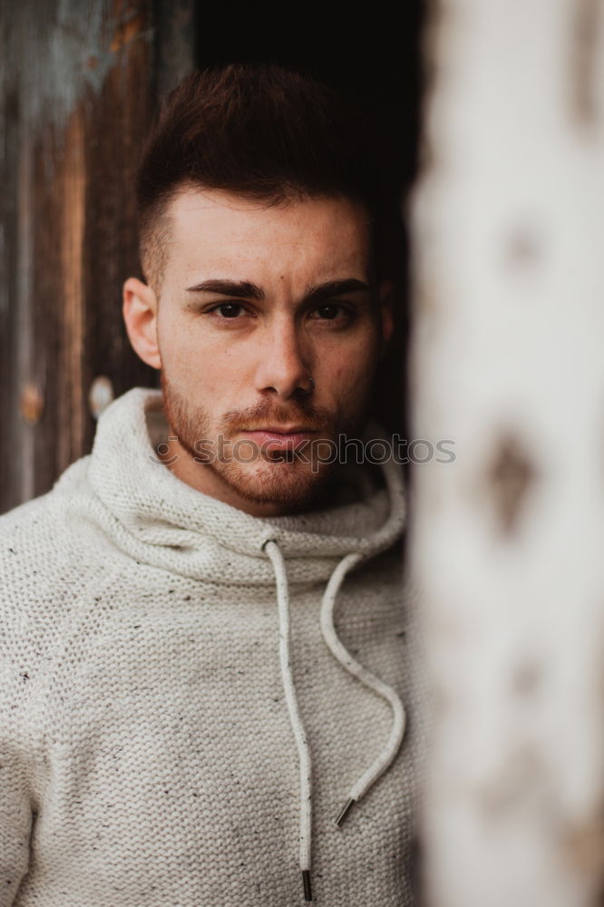 Atractive guy with jacket with military stylish in a vintage house