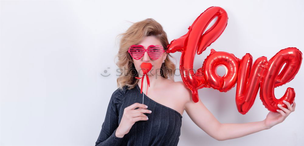 Similar – Young woman holding a red heart