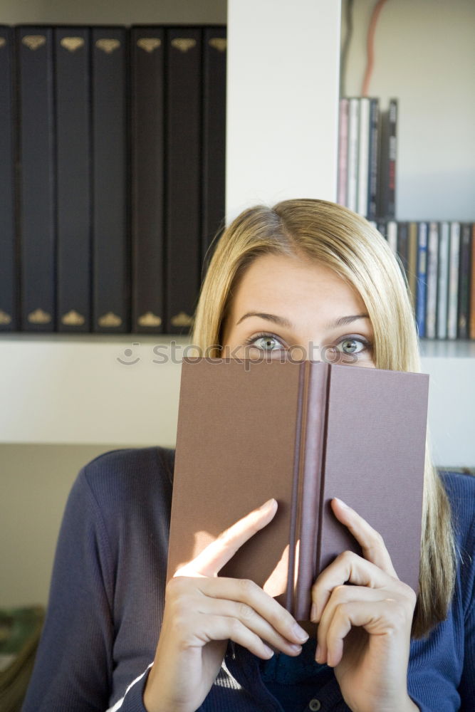 Similar – Image, Stock Photo Blonde girl using a smartphone while sitting on leather sofa
