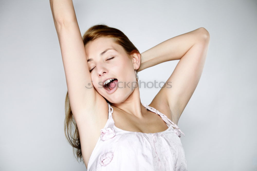 Similar – Young smiling blond woman leaning against wall