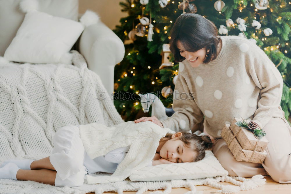 Similar – Image, Stock Photo Mother and son putting christmas costume on