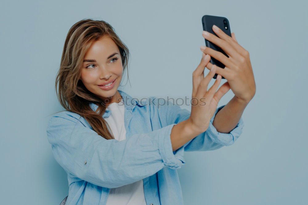 Similar – Image, Stock Photo Young beautiful woman in yellow dress using mobile phone