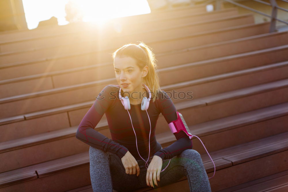 Similar – young woman runner eating an apple