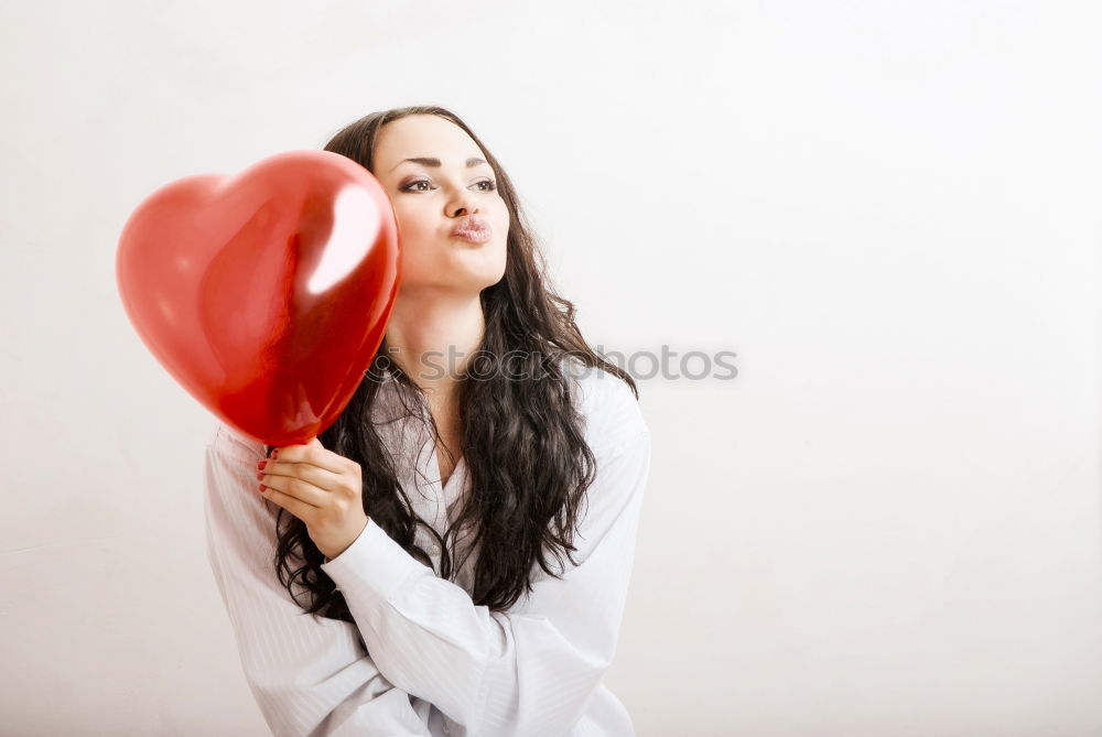 Similar – Young woman holding a red heart