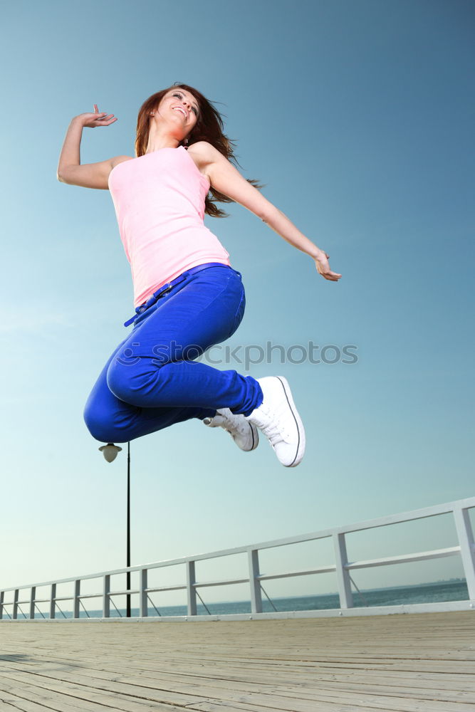 Similar – Young fitness woman runner running on city bridge.