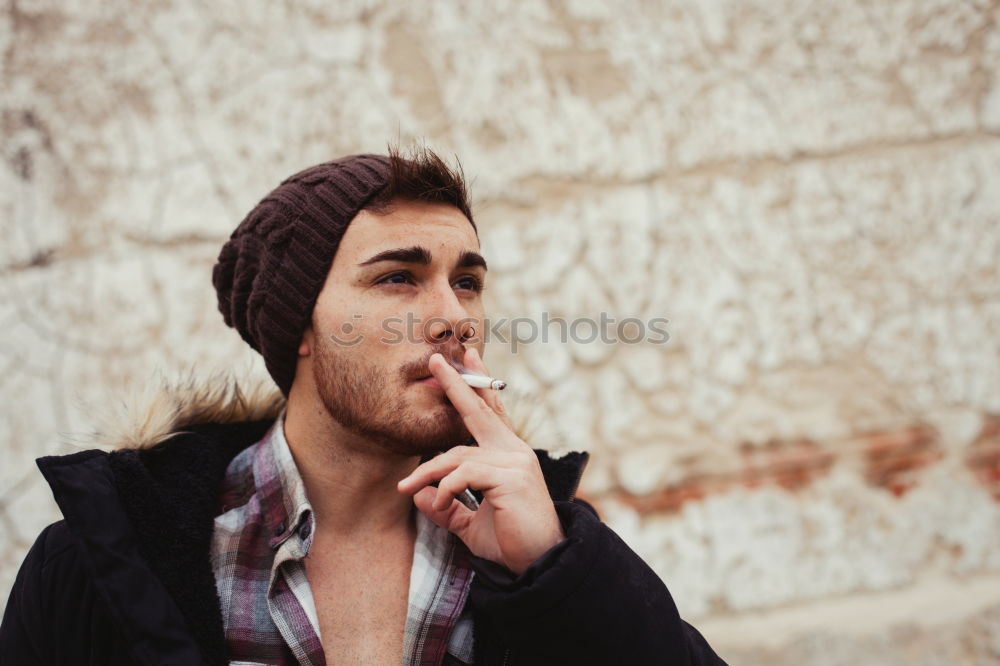 Similar – Portrait of attractive guy with wool hat in a old house