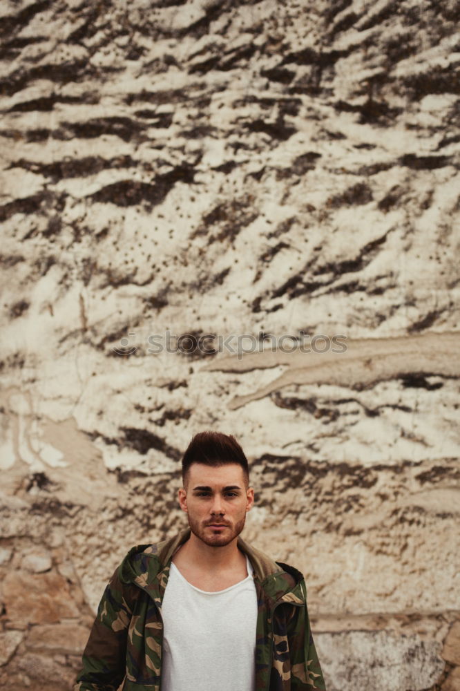 Similar – Image, Stock Photo Young handsome man over a dark brick wall