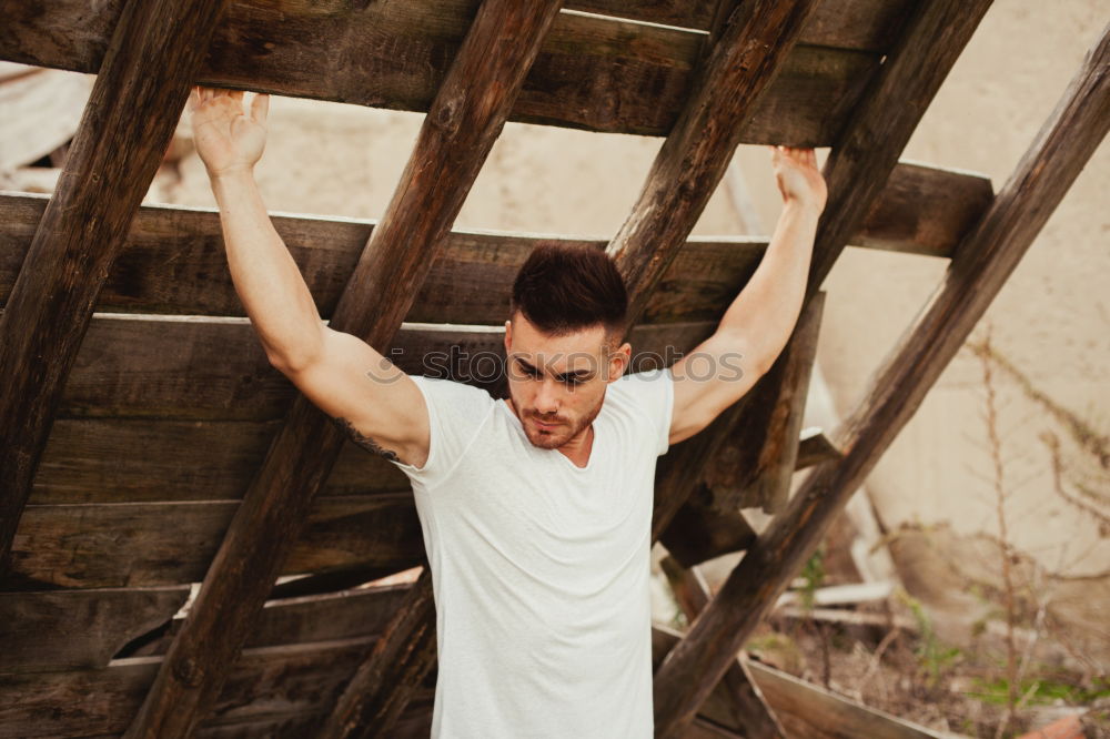 Similar – young man wearing suspenders in urban background