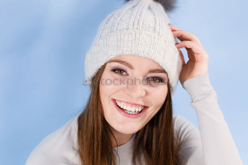 Similar – Image, Stock Photo Young redhead smiling woman in yellow hipster beanie cap pulls FFP2 mask away from face below