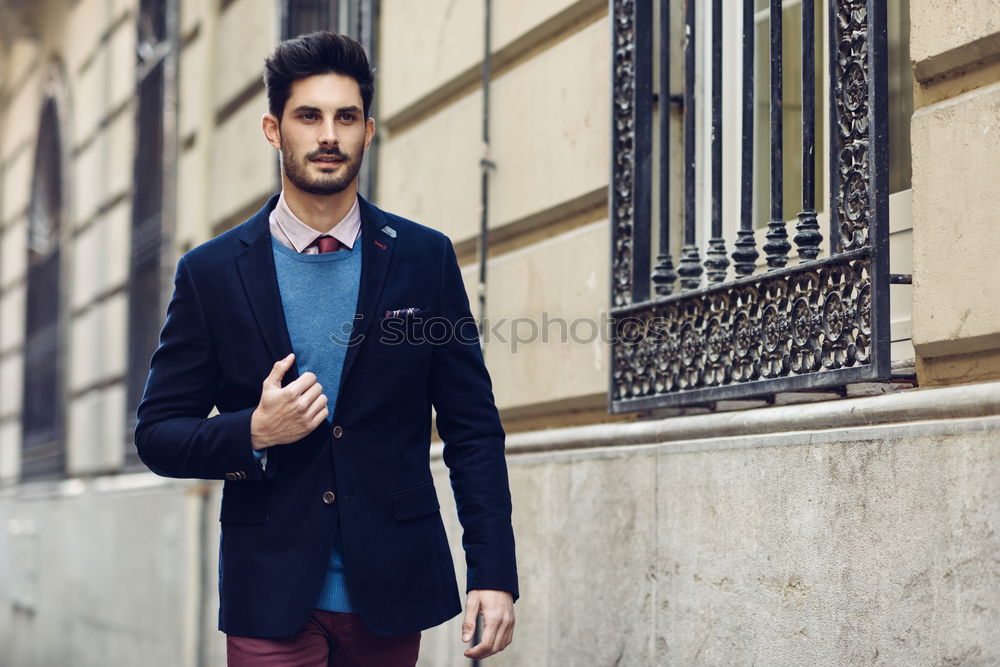 Similar – Young bearded man, model of fashion, sitting on urban step