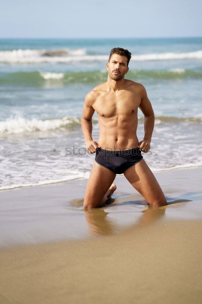 Similar – Handsome muscular man bathing on the beach