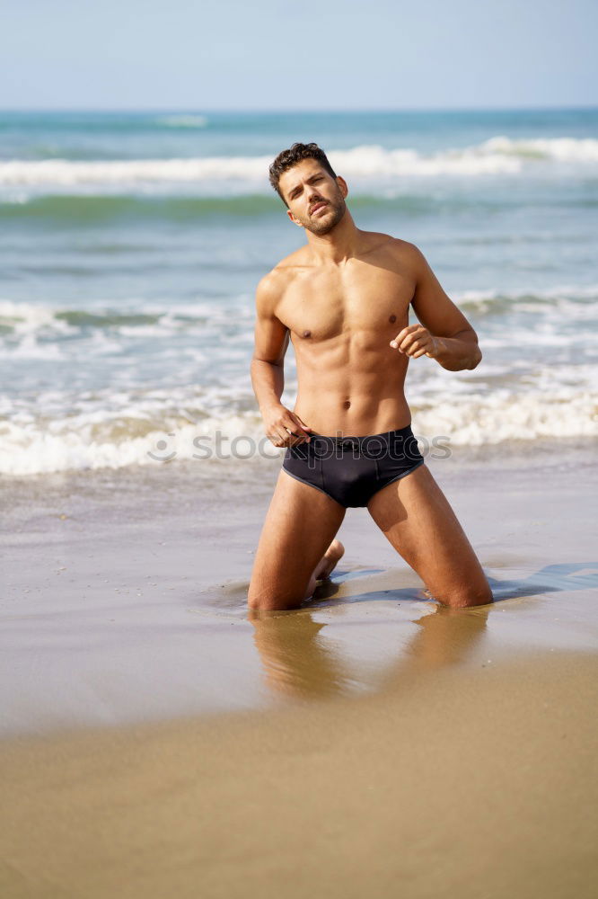 Similar – Handsome muscular man bathing on the beach