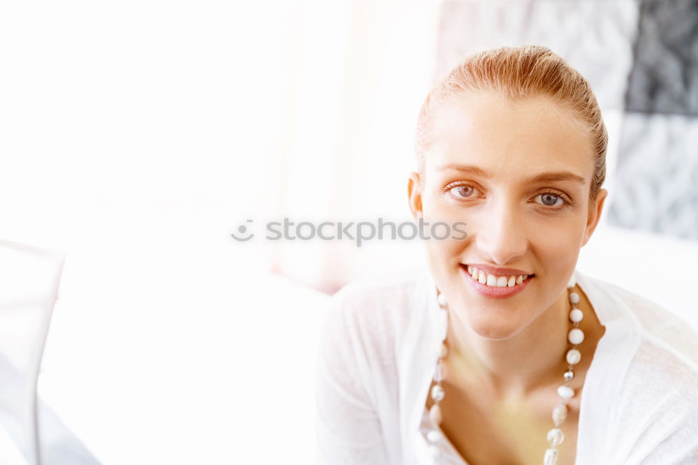 Similar – Young thoughtful woman looking through the window