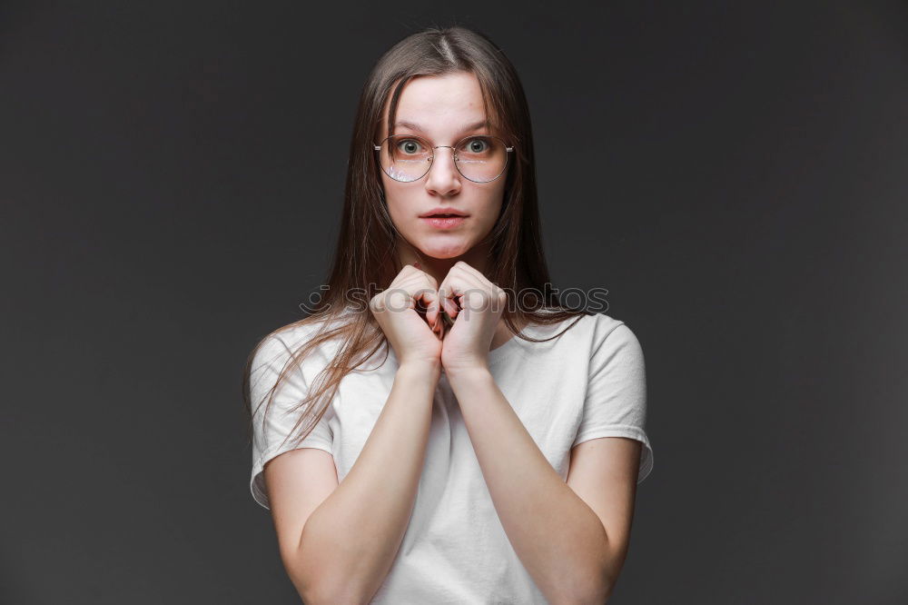 Similar – Elegant young woman doing silent gesture