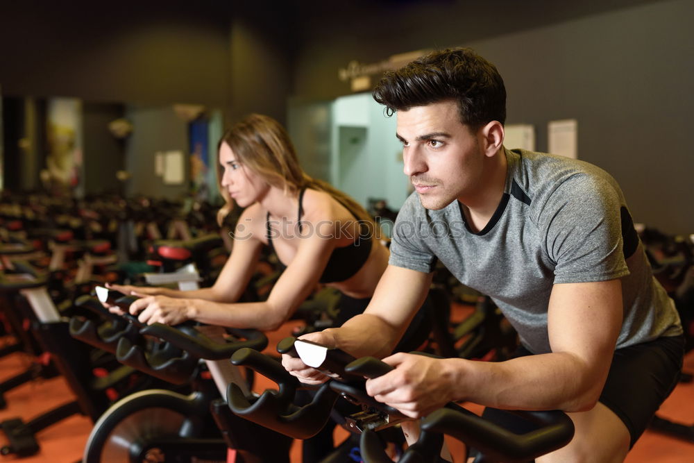 Image, Stock Photo Couple in a spinning class wearing sportswear.