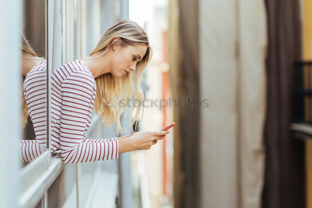 Dreaming girl looking away in window