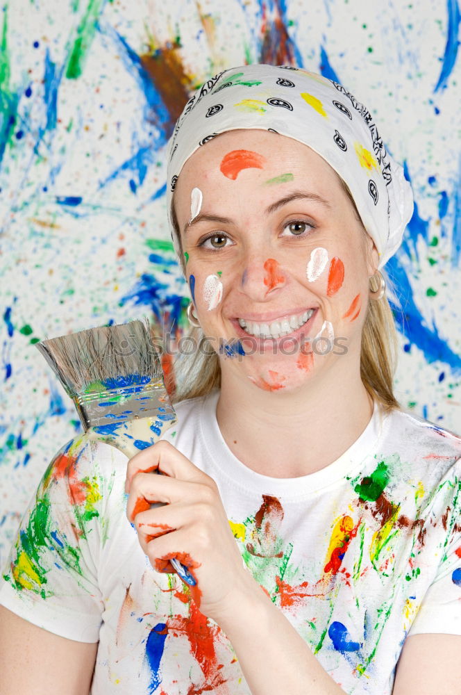 Similar – Junge Frau mit Farbe im Gesicht und einem Pinsel.