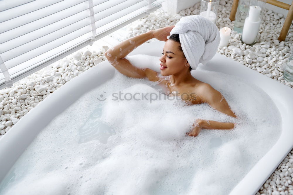 Similar – Woman lying in tub doing hydrotherapy treatment