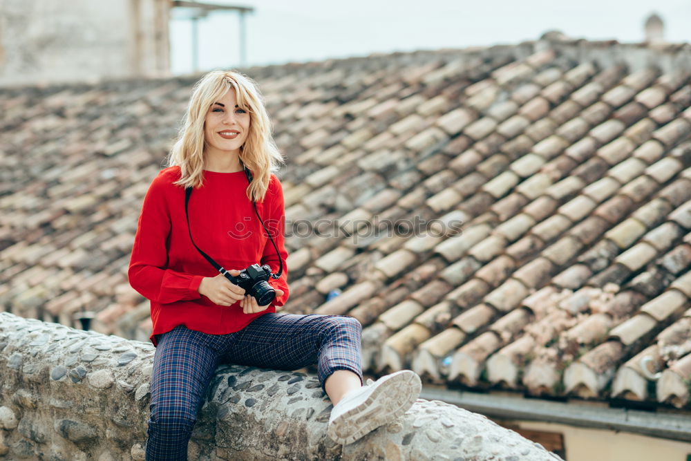 Similar – Smiling blonde girl with red shirt enjoying life outdoors.