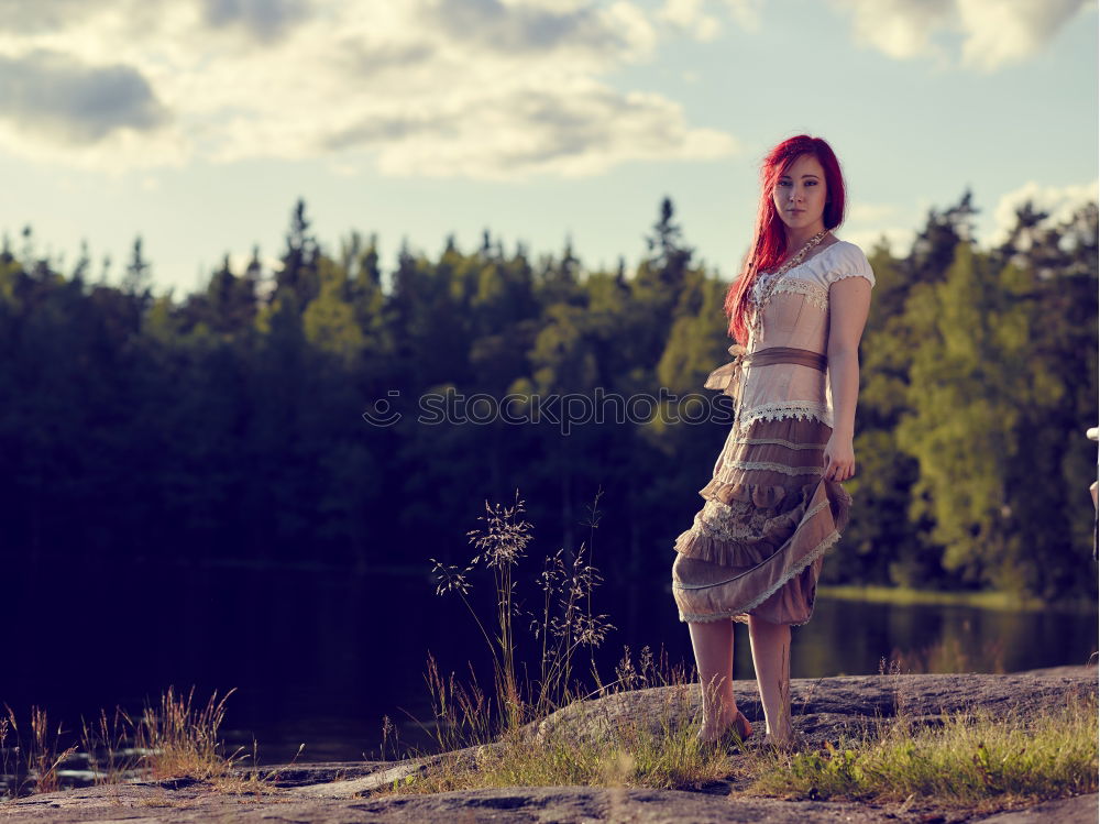 Similar – Image, Stock Photo Portrait of a young woman standing in a field in a summer dress