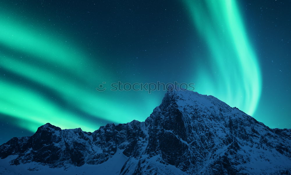 Norwegian mountain panorama with northern lights